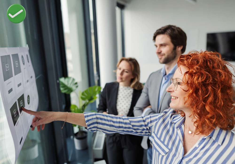 Marketing team reviewing brand visuals across website and digital ads