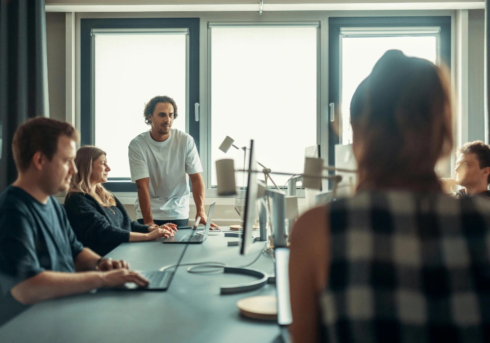 Marketing team planning cross-channel website and social media strategy